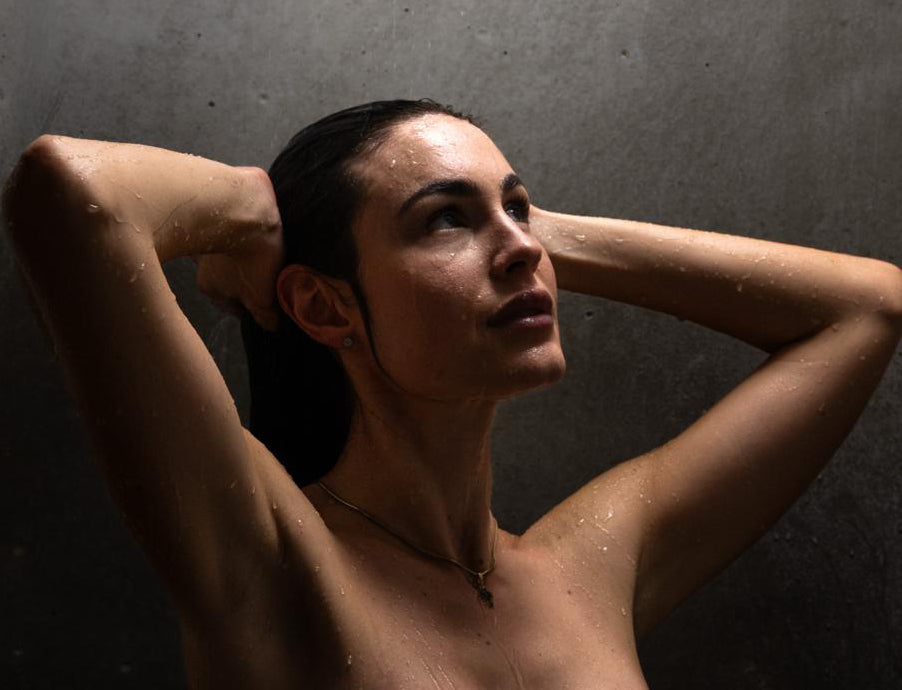 Woman enjoying relaxing shower with soft skin